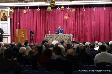 محاضرة الدكتور عبد القادر حصرية حول دعم العملة قاعة الصليب المقدس  